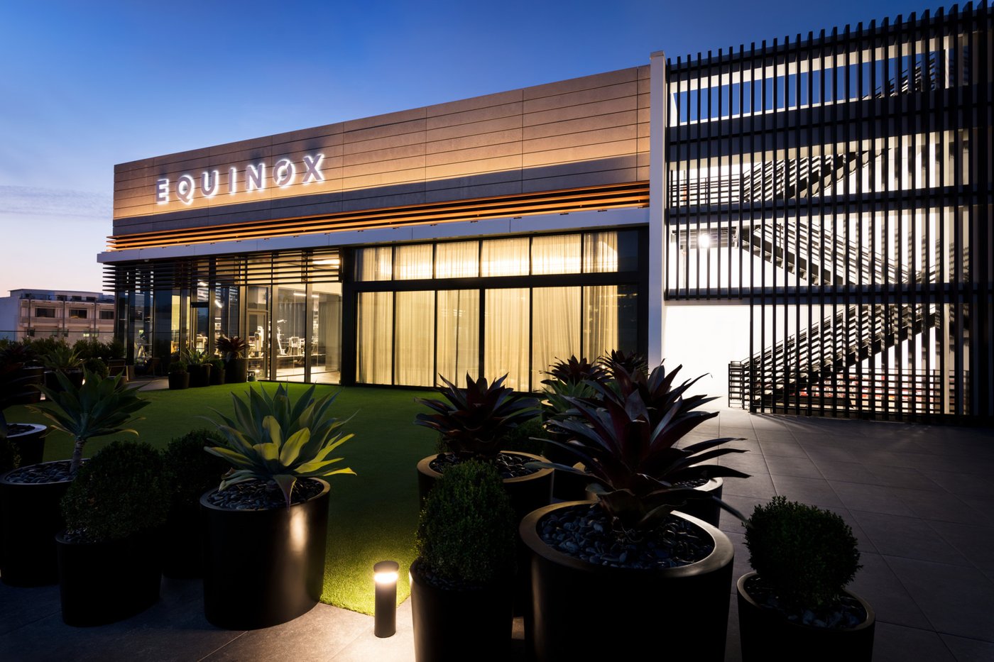 Equinox Century City exterior signage at dusk