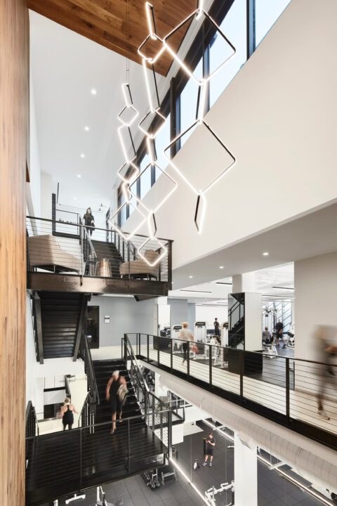 Equinox Plano atrium with a faceted light sculpture over the training levels