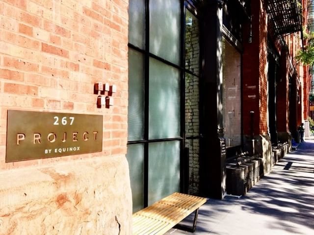 267 Project by Equinox brass signage on a brick facade