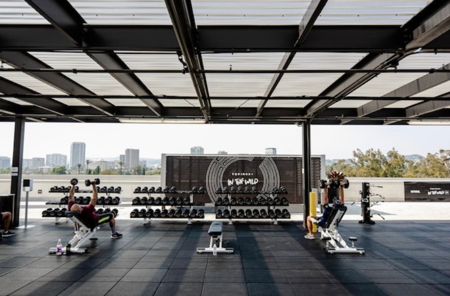 Covered rooftop training floor with city views