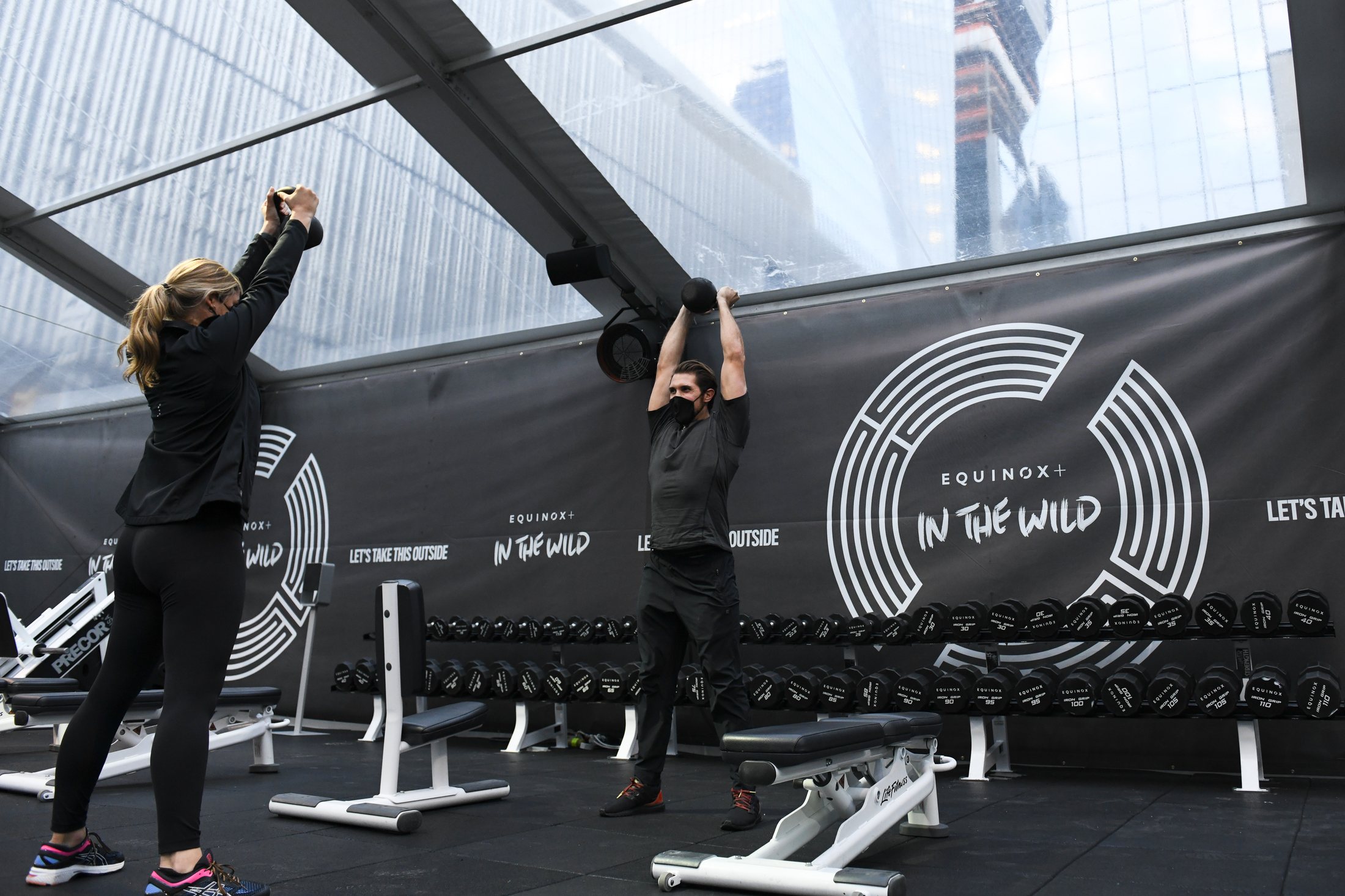 Open-air training under a clear tent against the New York skyline